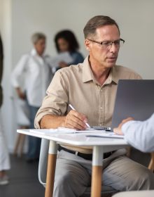 people-using-digital-device-while-meeting people-using-digital-device-while-meeting